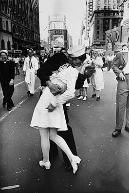 The V-J Day Times Square photograph of a US Navy sailor kissing a woman in a white dress amid a crowd of servicemen in dress whites, 1945