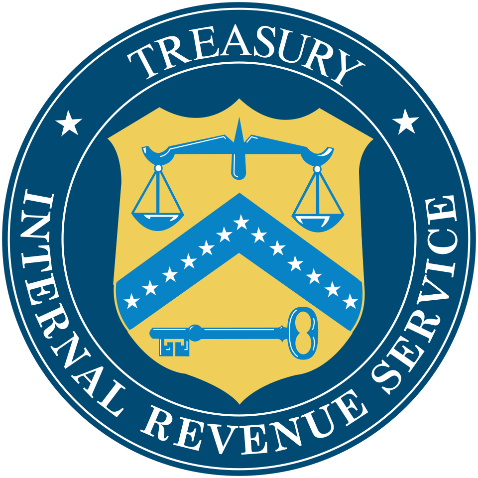The seal of the Internal Revenue Service, a shield with scales and key on a yellow-and-blue field beneath the word Treasury, 1862