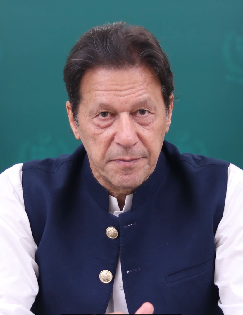 Imran Khan in a candid portrait, navy waistcoat over a white kurta against a Pakistan government backdrop, 2020