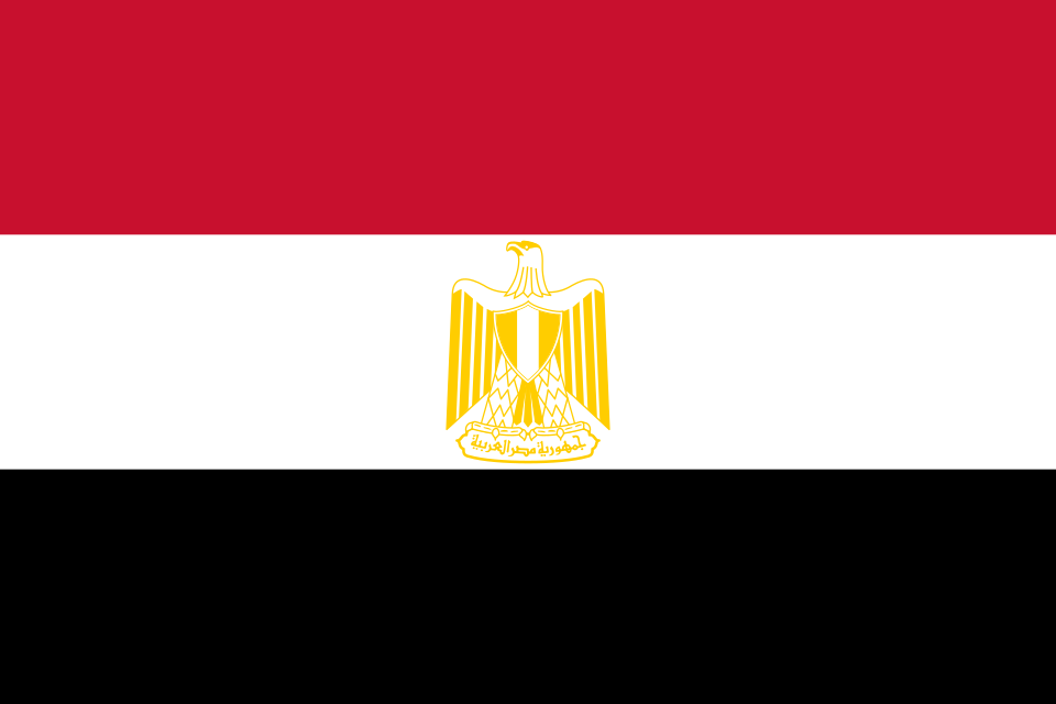 The flag of Egypt, red-white-black bands with the gold Eagle of Saladin on the white centre, 1984