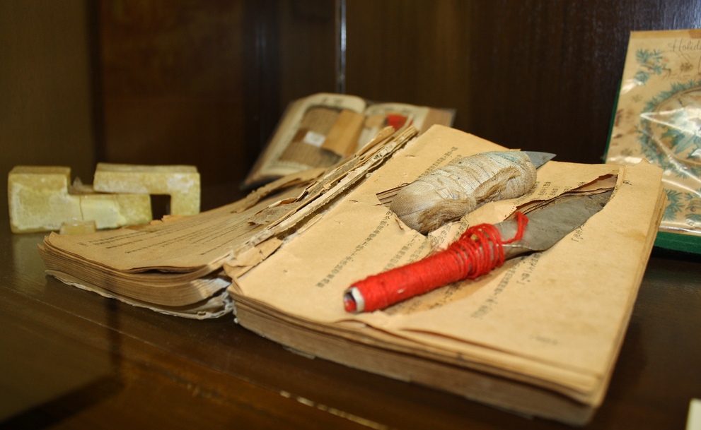 An improvised prison shank hidden inside the pages of a hollowed-out book, 2013