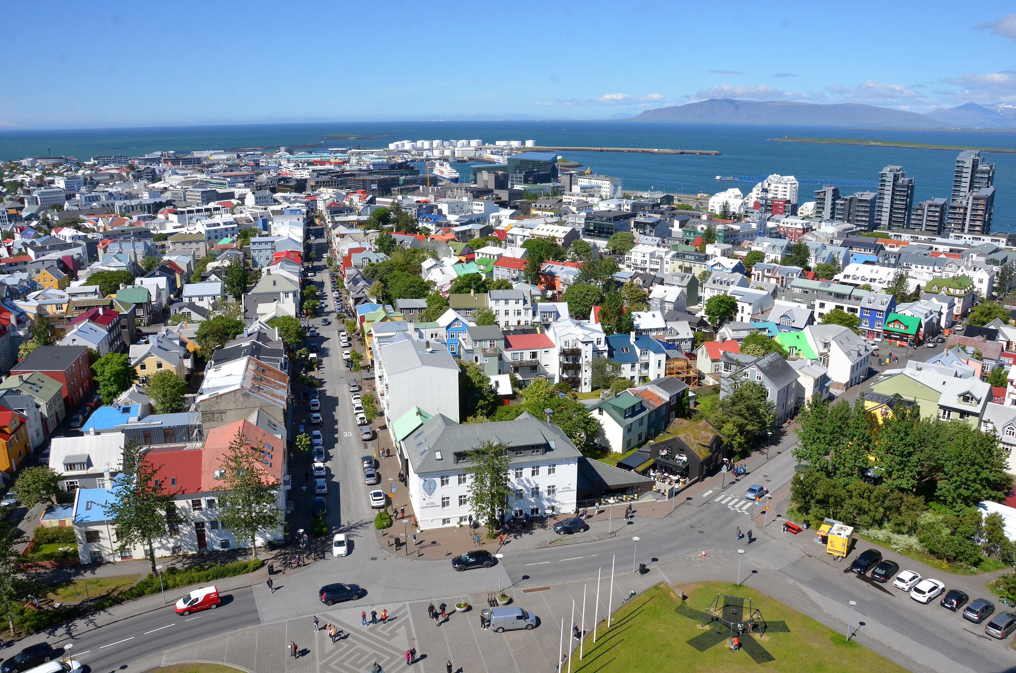 The Reykjavík skyline under low grey skies, colourful low-rise houses stretching toward Hallgrímskirkja on the ridge, 2015