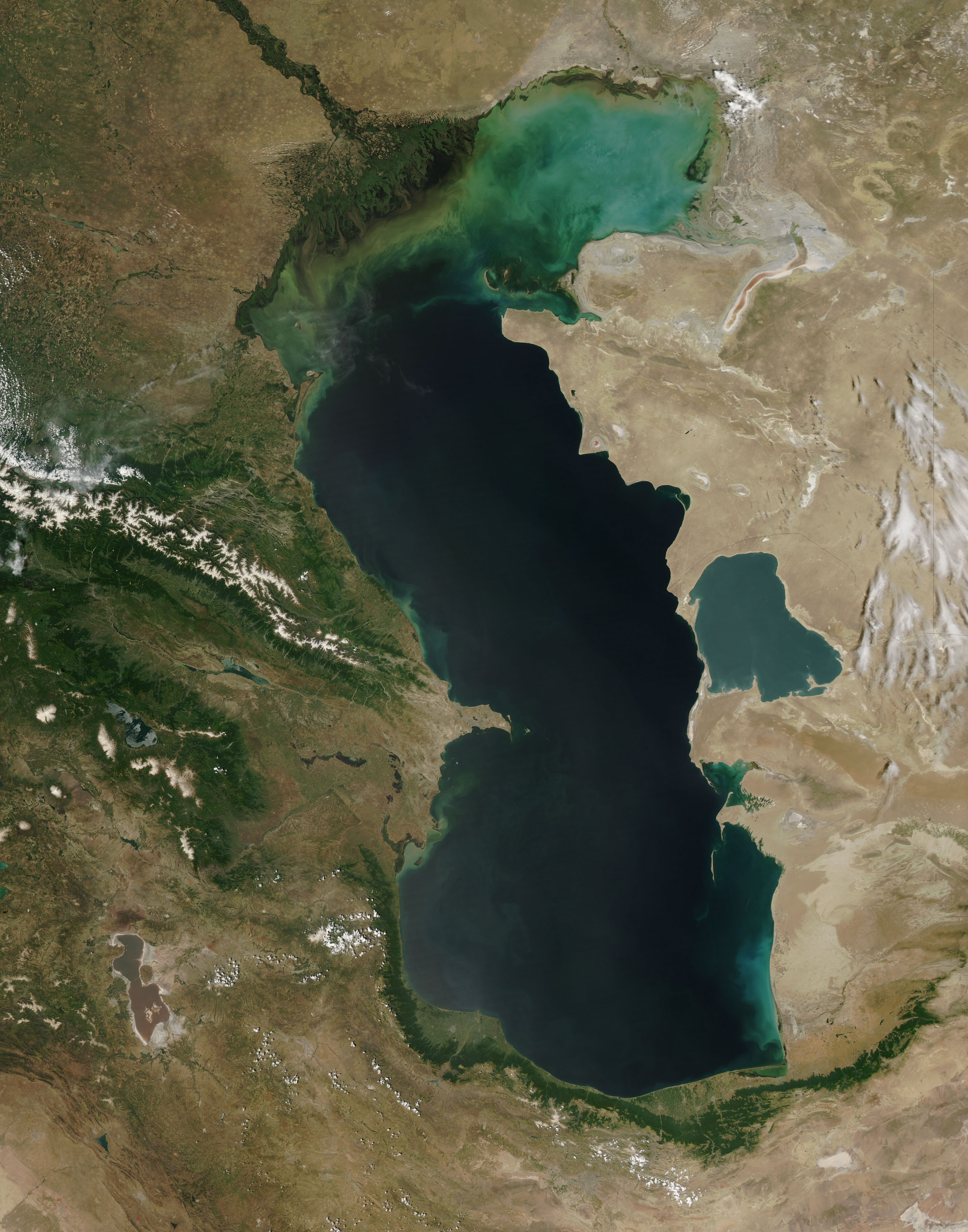 A NASA satellite view of the Caspian Sea, dark inland water framed by Iranian, Azeri and Kazakh coastlines, 2010