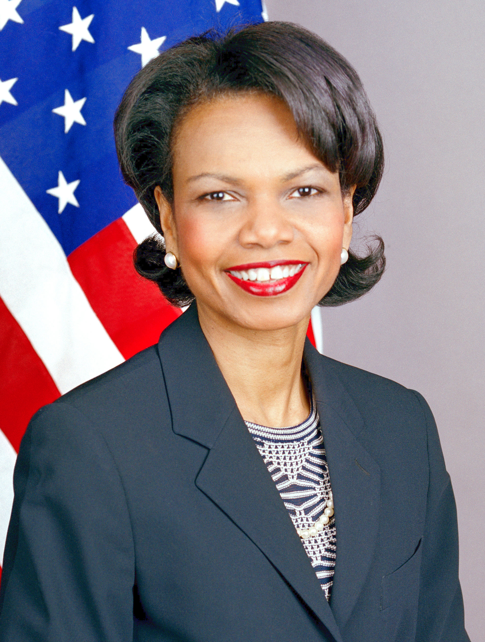 Condoleezza Rice in an official State Department portrait, US flag behind her, 2005