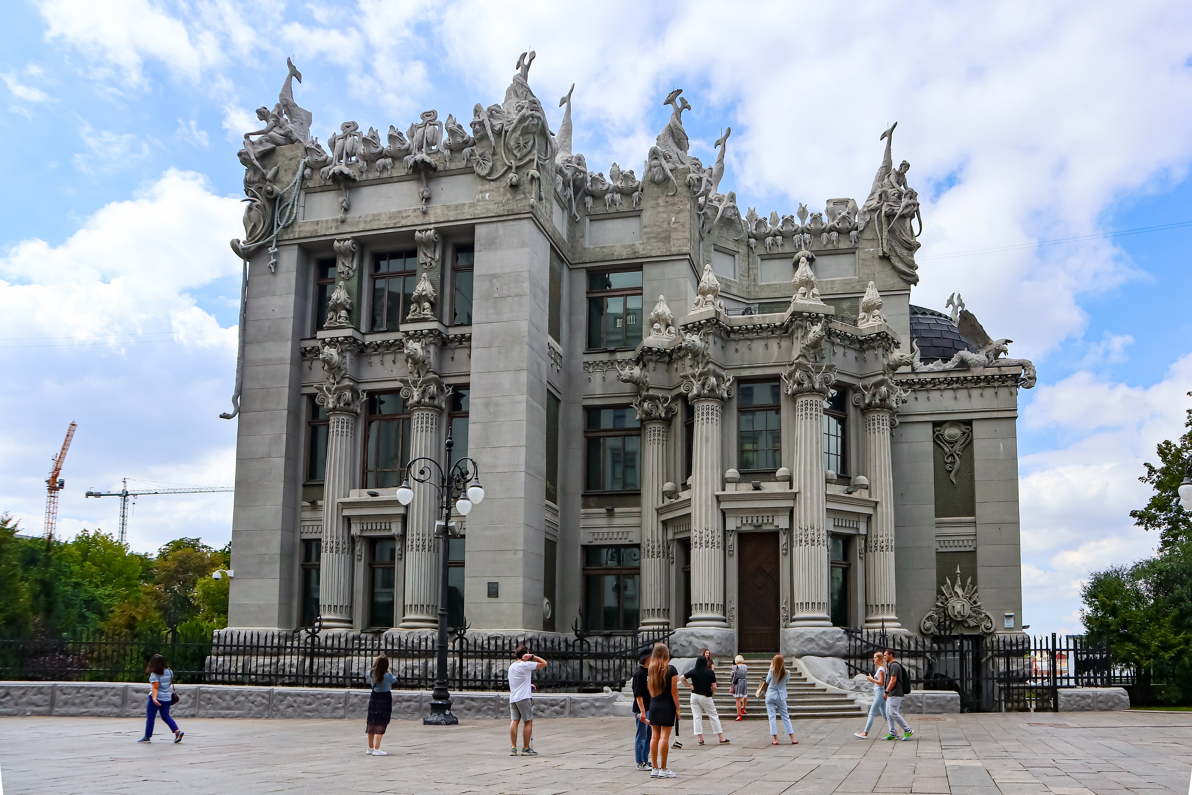 The House with Chimaeras in central Kyiv, a grey Art Nouveau building crowded with rooftop sculptures of frogs, elephants and mermaids above Corinthian columns, 2015