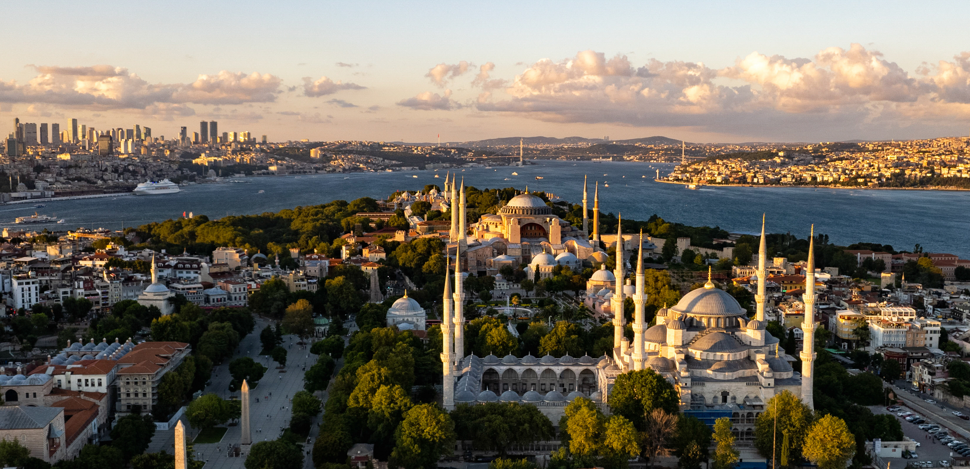 Aerial view of Istanbul at golden hour with Hagia Sophia and the Blue Mosque above the Bosphorus, 2018